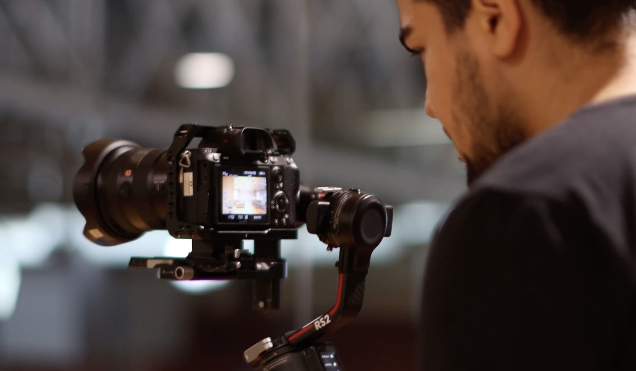 Freelance Videographer Photographer holding camera.